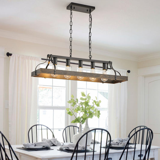 34-inch black and gold vintage chandelier with 5 antique lights, hanging over a dining table with white curtains and greenery.