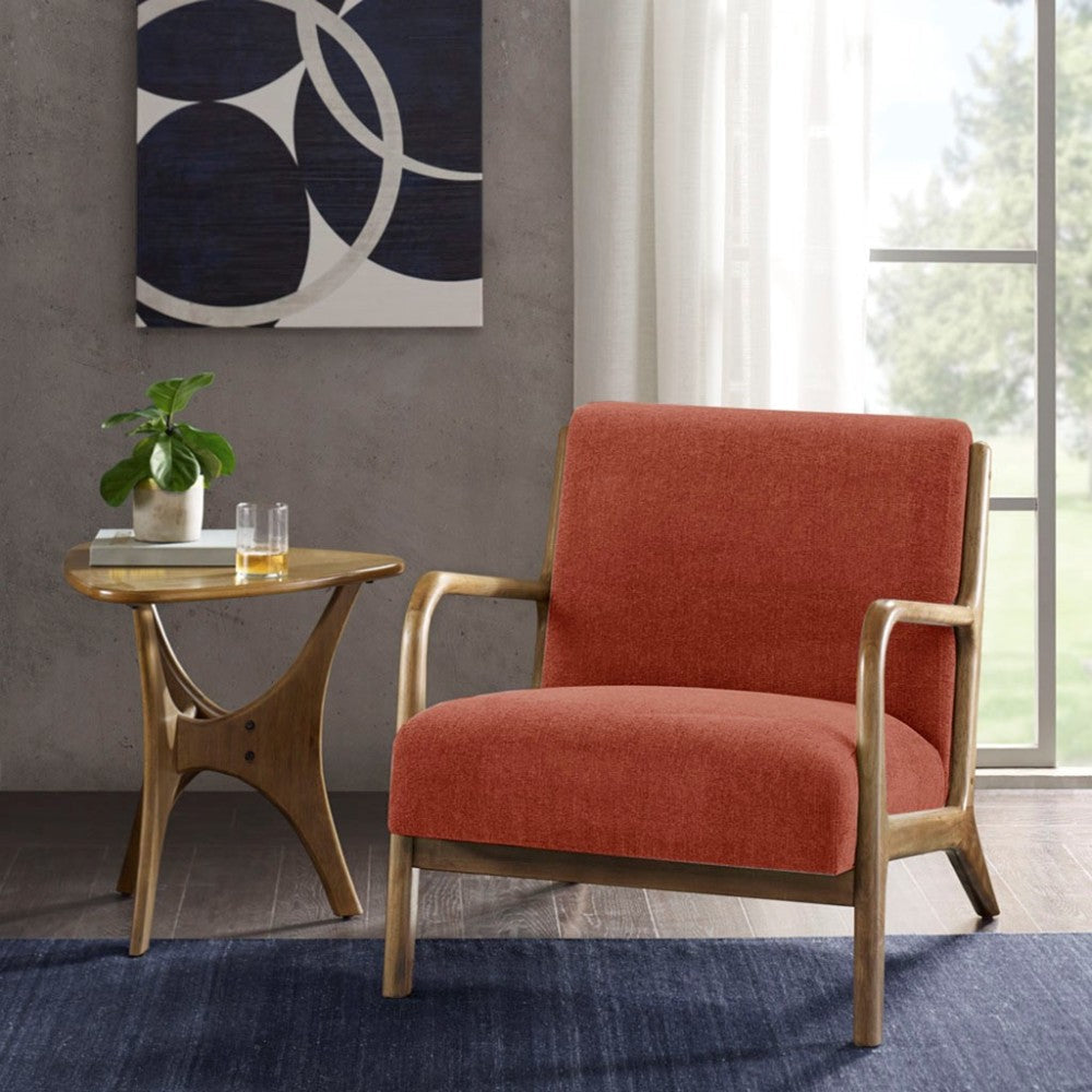 Orange upholstered accent chair with wooden frame, beside a small side table with a potted plant.