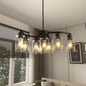 Black 9-light modern farmhouse chandelier with clear glass shades, adjustable height, dimmable, for dining room or kitchen island.