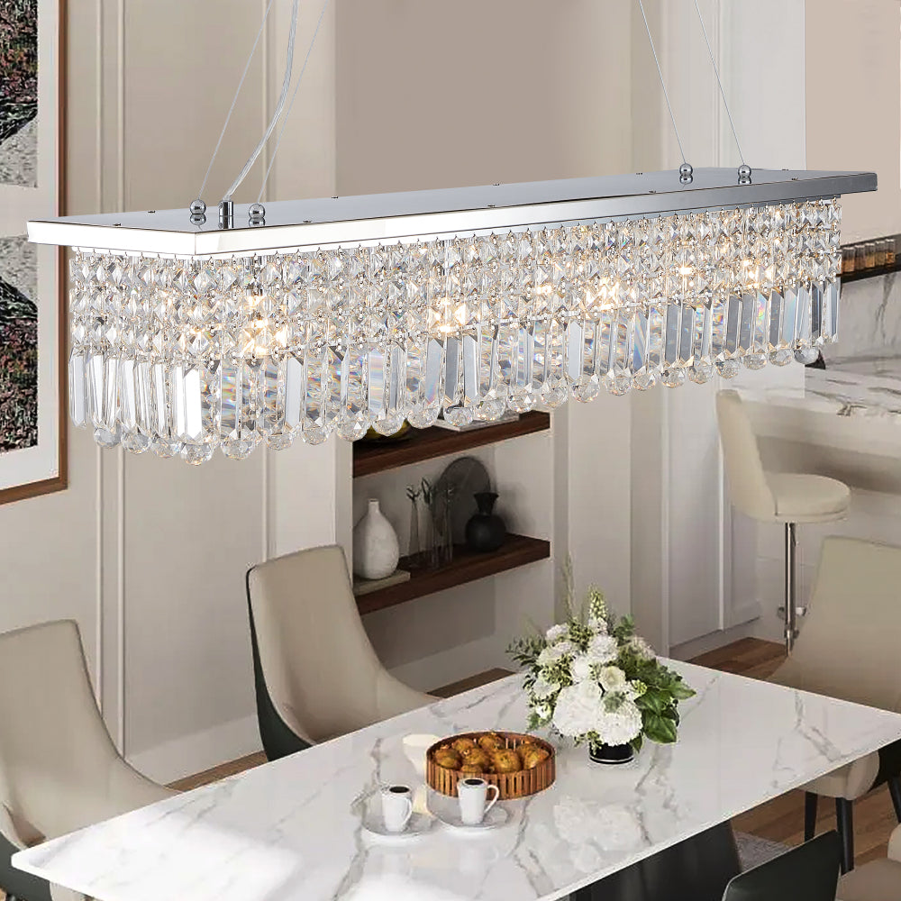 Close-up of 39.4-inch rectangle crystal raindrop chandelier with 8 lights, chrome finish, in dining space with marble table
