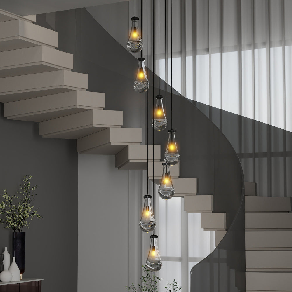 Black 7-light raindrop cluster pendant chandelier with clear glass drops hanging in a modern stairwell with floating steps and sheer curtains