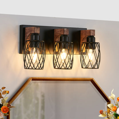 Industrial black metal cage wall sconce with wood accents, 3-light vintage fixture mounted above bathroom mirror with floral decor