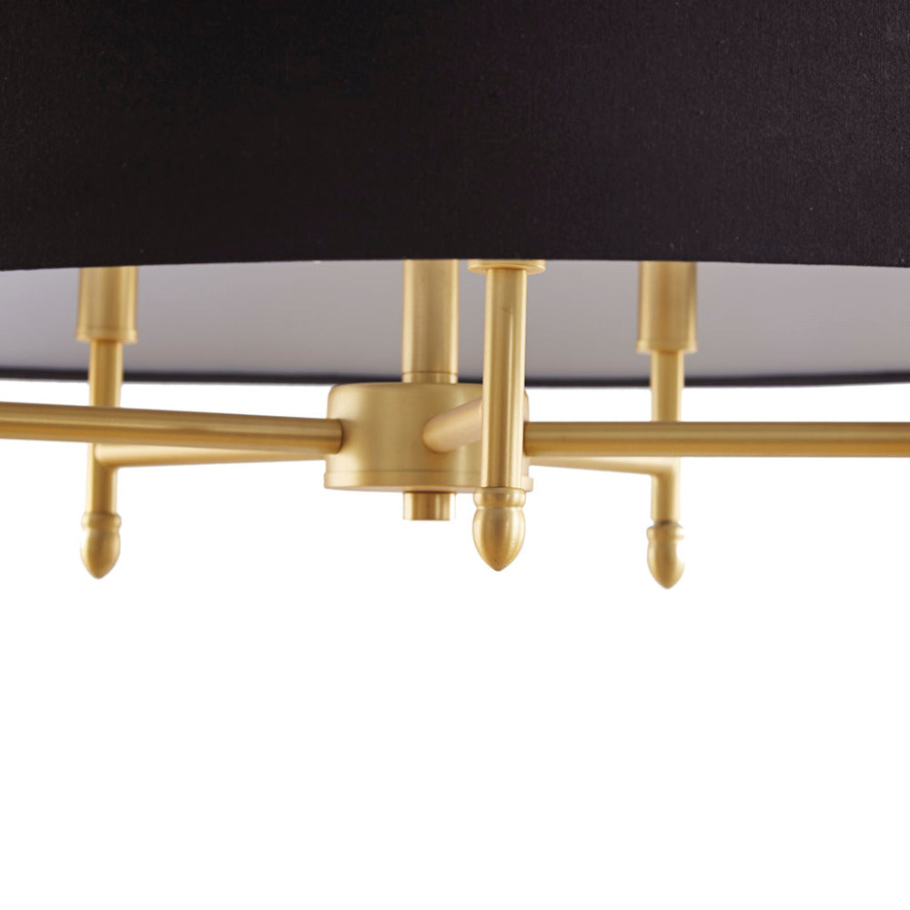 Close-up of 5-light drum shade chandelier's gold plated brass fixture with black cotton-linen shade, showing detailed hardware
