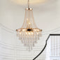 Close-up of 20-inch K9 crystal chandelier with gold finish, 11 lights, adjustable height 33-71 inches, featuring crystal drops and lit bulbs.