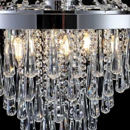 Close-up of 20" K9 crystal chandelier featuring crystal teardrops, chrome frame, and illuminated bulbs.