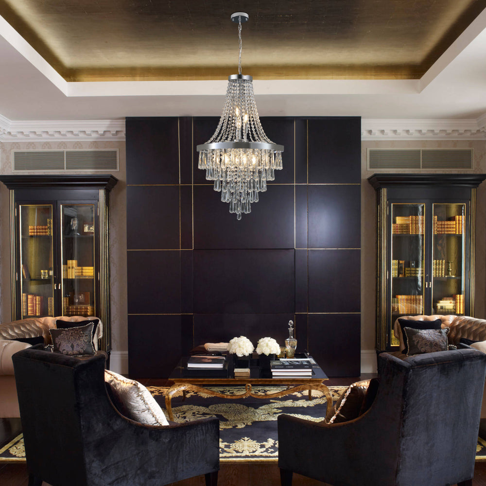 20-inch K9 crystal chandelier with chrome finish, 11 lights, adjustable height 33-71 inches, hanging in a dark-paneled room with gold ceiling accents, black velvet chairs, and bookshelves.