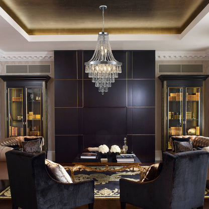 20-inch K9 crystal chandelier with chrome finish, 11 lights, adjustable height 33-71 inches, hanging in a dark-paneled room with gold ceiling accents, black velvet chairs, and bookshelves.