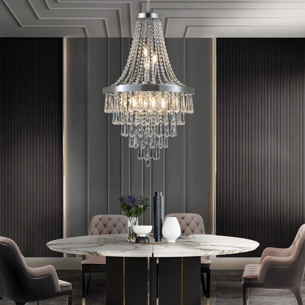 20-inch K9 crystal chandelier with chrome finish, 11 lights, adjustable height 33-71 inches, hanging over a marble dining table in a modern dining room with dark paneled walls and tufted chairs.