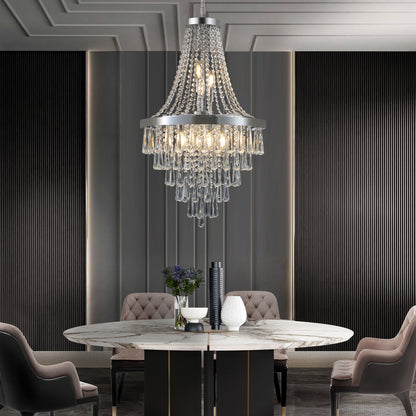 20-inch K9 crystal chandelier with chrome finish, 11 lights, adjustable height 33-71 inches, hanging over a marble dining table in a modern dining room with dark paneled walls and tufted chairs.