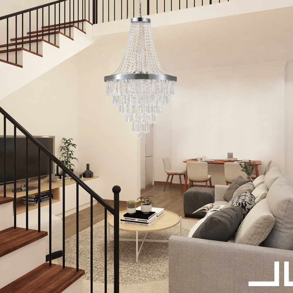 20-inch K9 crystal chandelier with chrome finish, 11 lights, adjustable height 33-71 inches, hanging in a modern living space with a staircase, light gray sofa, and neutral decor.