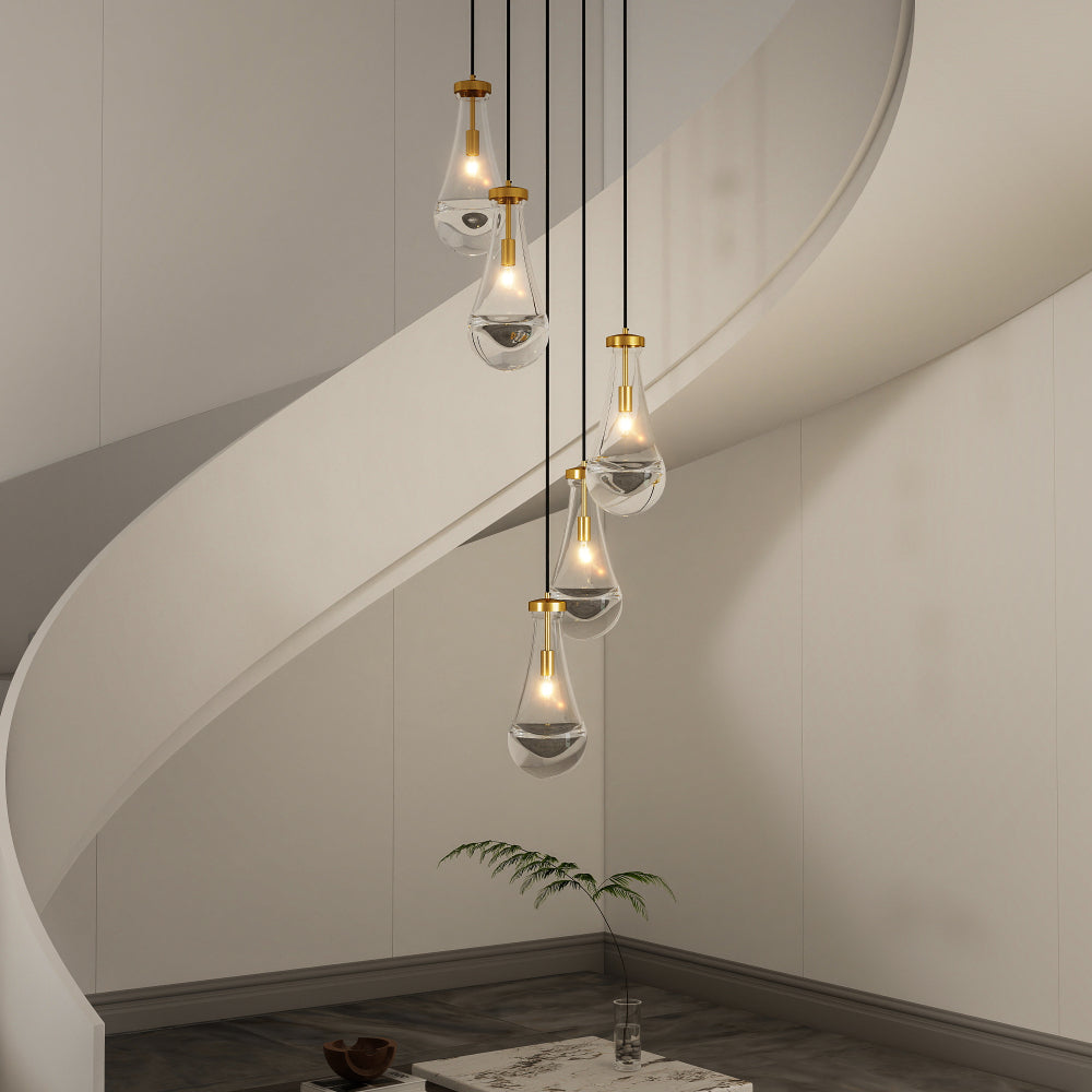 5-light raindrop cluster pendant chandelier with hand-blown glass, gold finish, adjustable length, hanging in modern stairwell