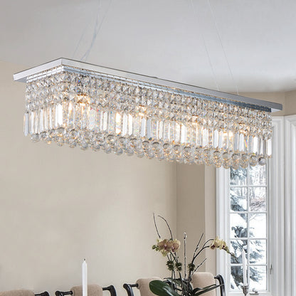 39.4-inch rectangular crystal raindrop chandelier installed in a dining room, featuring chrome finish and illuminated crystal drops creating an elegant ambiance.