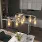 Chrome 9-light modern farmhouse chandelier with clear glass shades, adjustable height, dimmable, for dining room or kitchen island.