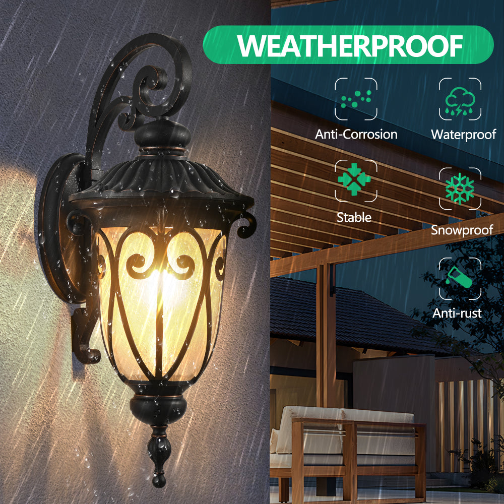 Black outdoor wall lantern with clear glass, illuminated in rain, demonstrating weatherproof and anti-corrosion durability.