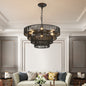 Rustic hemp rope 4-tier chandelier with warm bulbs in a living room with a beige tufted sofa and decorative throw pillows