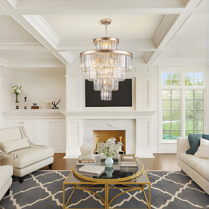 23.6-inch 5-tier K9 crystal chandelier with gold frame in a living room with white fireplace, coffered ceiling, and beige armchairs