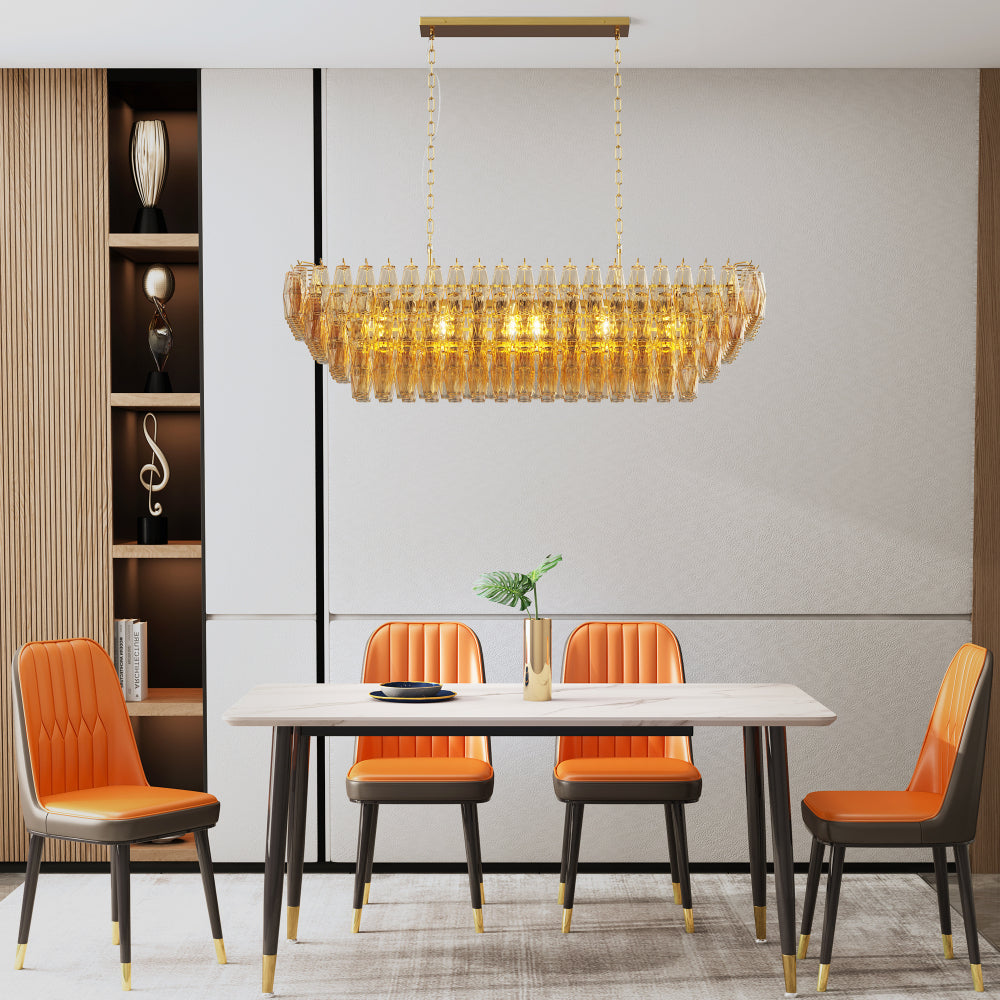 Tiered Smoke Glass Chandelier with gold metal frame, 14-light round, hanging in a dining room with orange chairs and white marble table.