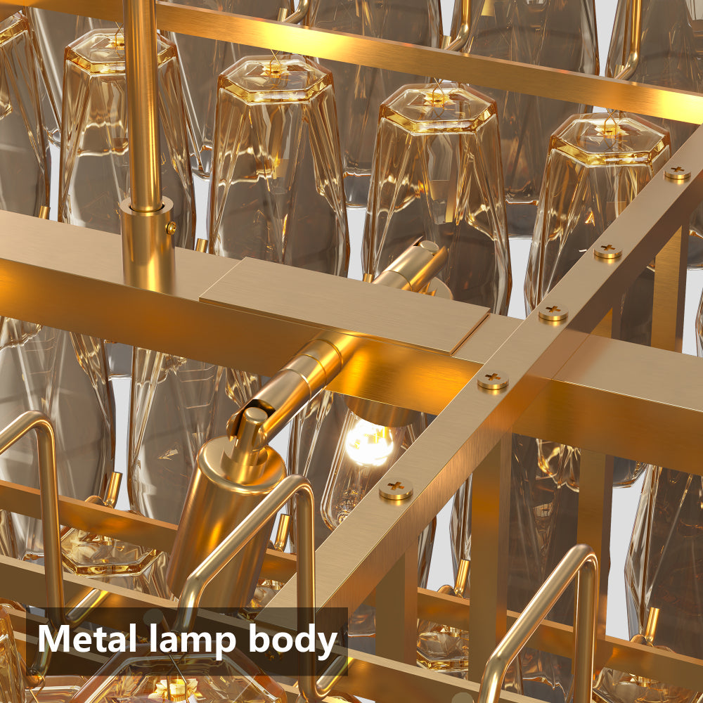 Close-up of tiered smoke glass chandelier's gold metal frame and faceted glass shades