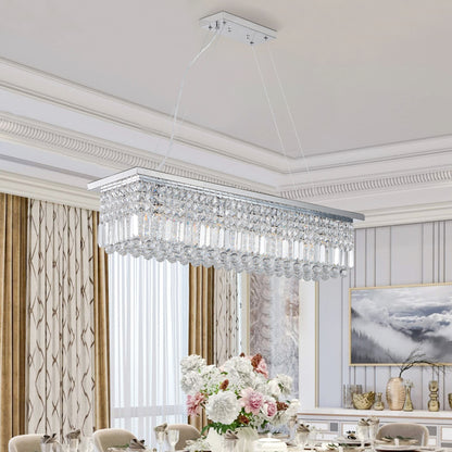 39.4-inch rectangle crystal raindrop chandelier with 8 lights, chrome finish, hanging over formal dining table with floral centerpiece