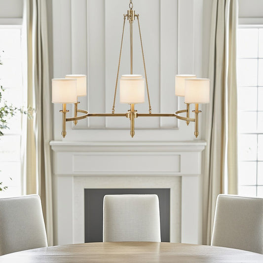 Gold 6-light drum shade chandelier with curved frame, transitional style, 39.25 inches wide, Bedford Collection, installed in dining room with fireplace and table.