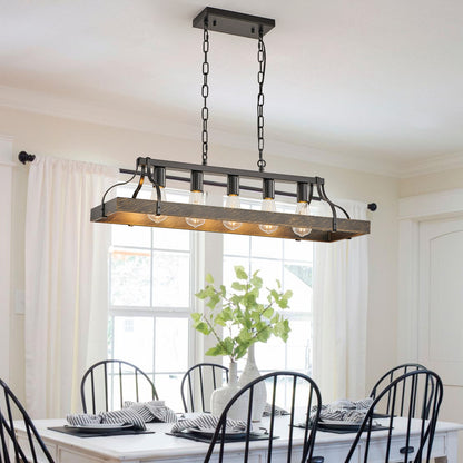 34-inch black and gold vintage 5-light chandelier with adjustable chain, hanging over a dining table with white curtains and greenery