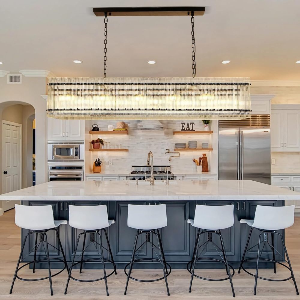 Rectangular black crystal glass chandelier with water ripple design, hanging over kitchen island in modern kitchen.