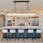 Rectangular black crystal glass chandelier with water ripple design, hanging over kitchen island in modern kitchen.