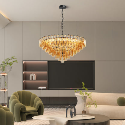 Round tiered smoke glass chandelier with gold metal frame, 14 lights, 37 inches wide, dimmable, in a contemporary living room with green armchairs and neutral walls