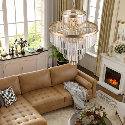23.6-inch 5-tier K9 crystal chandelier with gold frame hanging in a living room with beige leather sofa and fireplace