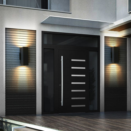 2-pack modern black outdoor wall sconces with up & down lighting mounted on either side of a front door, illuminating porch area