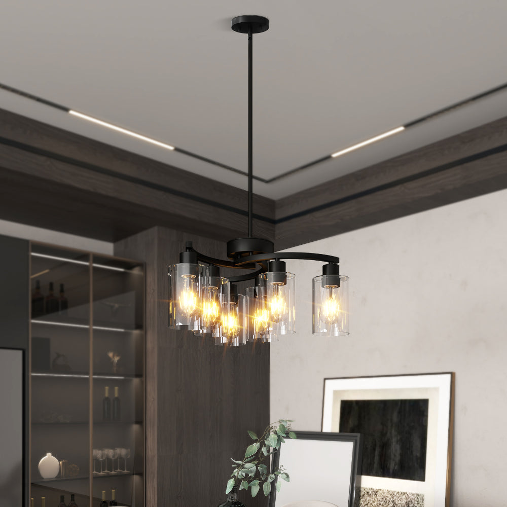 Black Modern Farmhouse 6-light chandelier with clear glass shades, warm light, installed in a stylish dining room with wooden cabinetry.