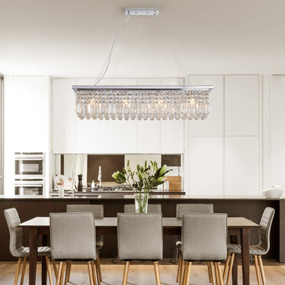 39.4-inch rectangle crystal raindrop chandelier with 8 lights, chrome finish, hanging over dining table in modern kitchen