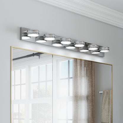 Modern chrome 6-light LED vanity light bar, 43 inches, mounted above a gold-framed bathroom mirror with bright, even illumination