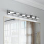 Modern chrome 6-light LED vanity light bar, 43 inches, mounted above a gold-framed bathroom mirror with bright, even illumination