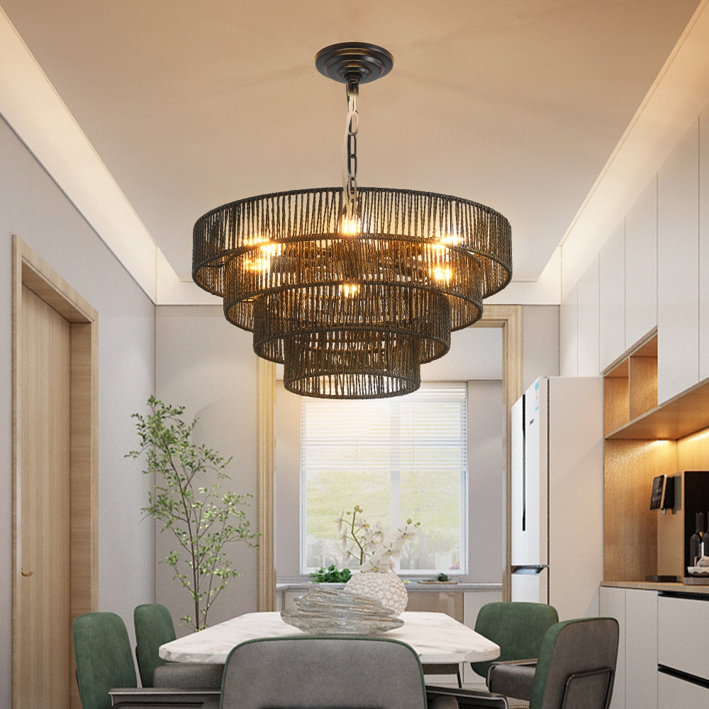 Rustic hemp rope 4-tier chandelier with warm glowing bulbs in a modern dining room featuring green upholstered chairs and a marble table
