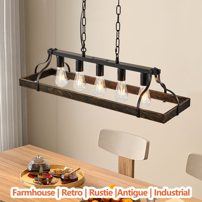 34-inch black and gold vintage chandelier with 5 lights, adjustable chain, hanging in dining room with farmhouse, retro, rustic, antique, industrial style above a wooden table