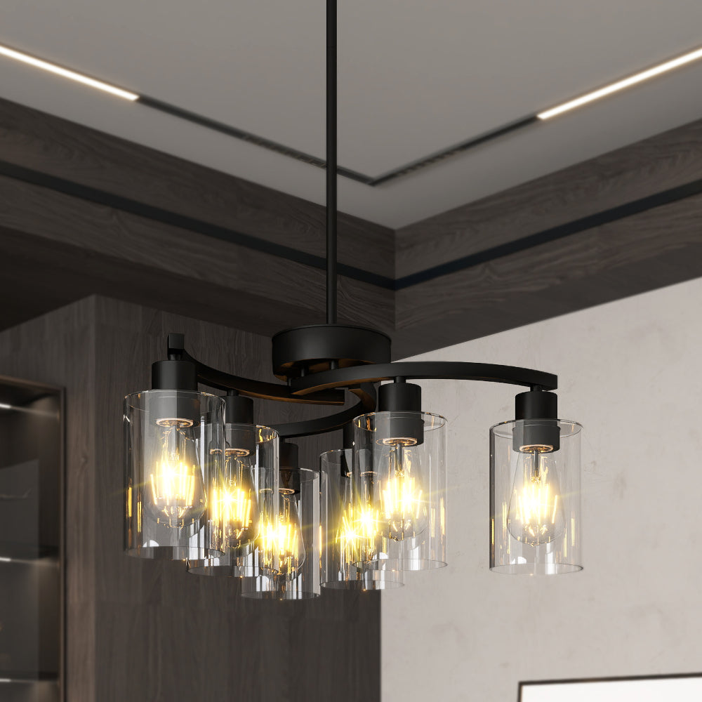 Black Modern Farmhouse 6-light chandelier with clear glass shades, warm Edison bulbs, hanging in a contemporary dining space.