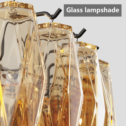 Close-up of tiered smoke glass chandelier's faceted glass lampshades with gold trim