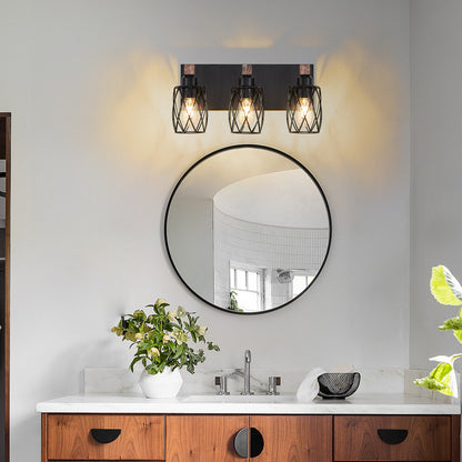 Industrial black metal cage wall sconce with wood accents, 3-light vintage fixture above round bathroom mirror with marble countertop and wooden vanity