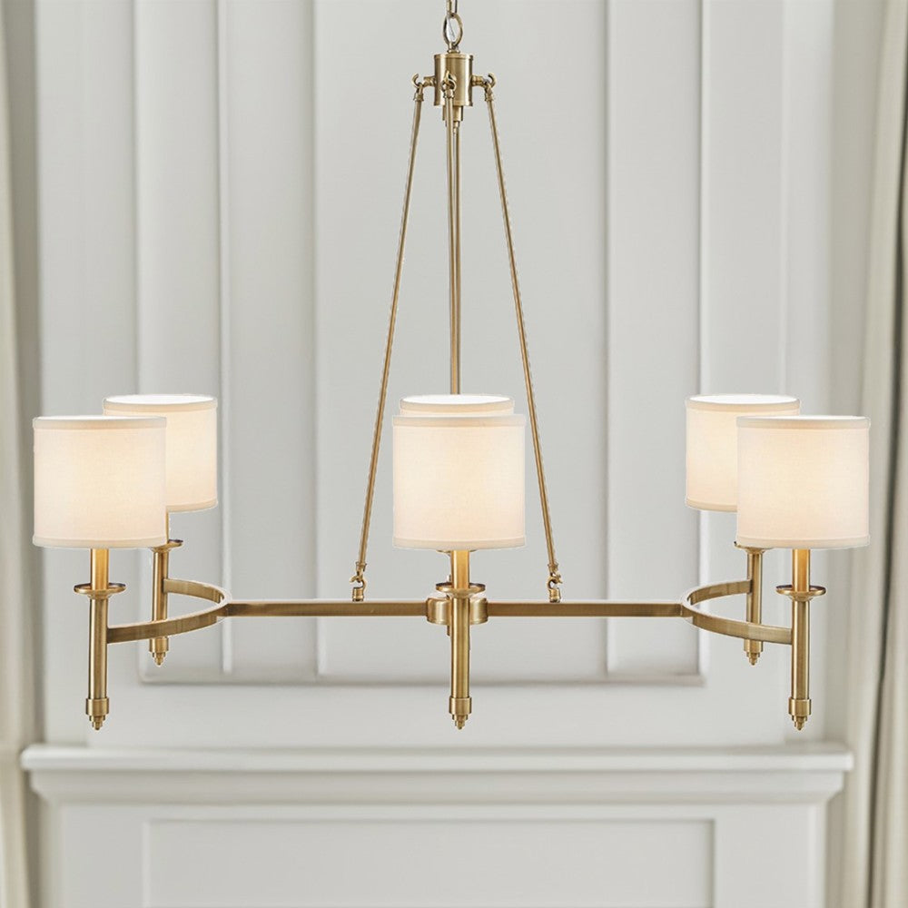 Gold 6-light drum shade chandelier with curved frame, transitional style, 39.25 inches wide, Bedford Collection, installed in room with paneled wall and mantel.