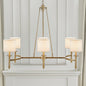 Gold 6-light drum shade chandelier with curved frame, transitional style, 39.25 inches wide, Bedford Collection, installed in room with paneled wall and mantel.