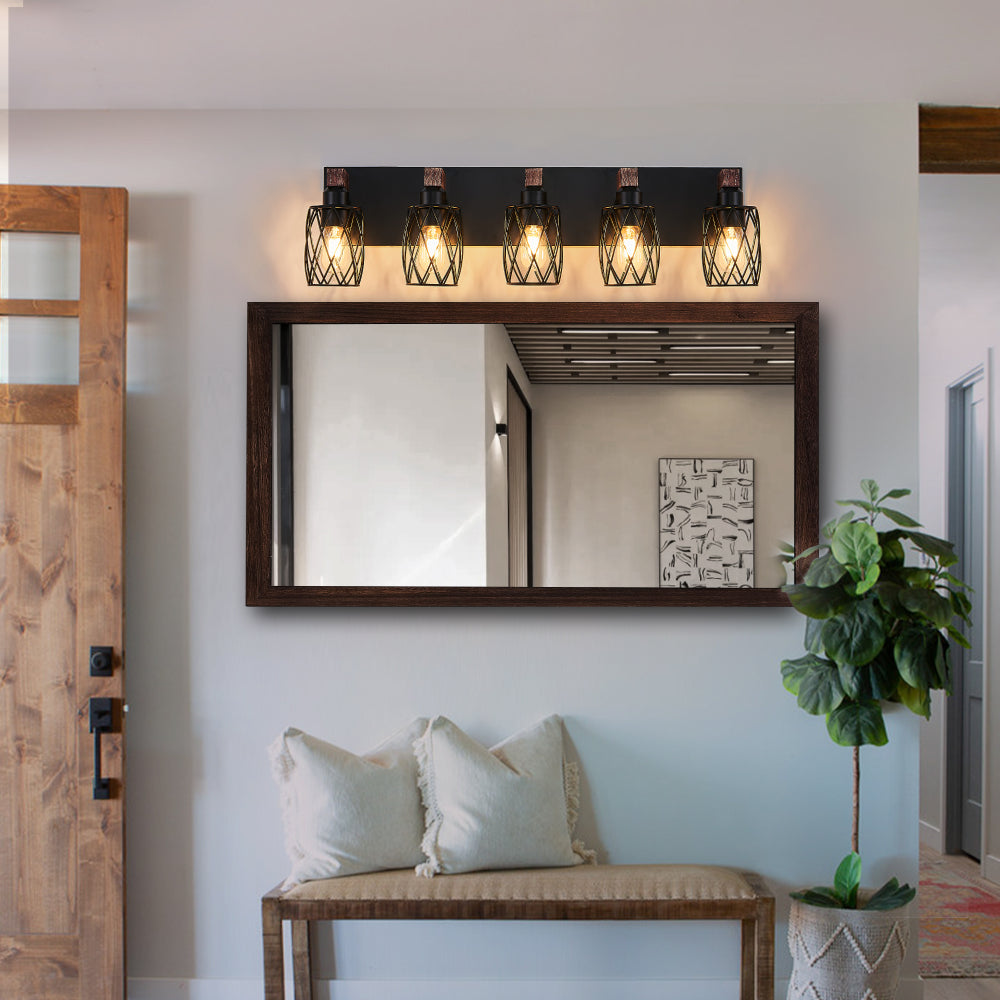 Industrial black metal cage wall sconce with wood accents, 5-light, 31-inch vintage fixture above mirror in entryway.