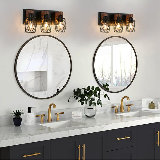 Pair of industrial black cage wall sconces with wood accents, 3-light vintage fixtures above double bathroom vanity with round mirrors and marble countertop