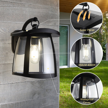 Black solar wall lantern with clear glass, featuring solar panel, 350LM 4000K LED bulb, and waterproof cover, mounted on a wooden wall.