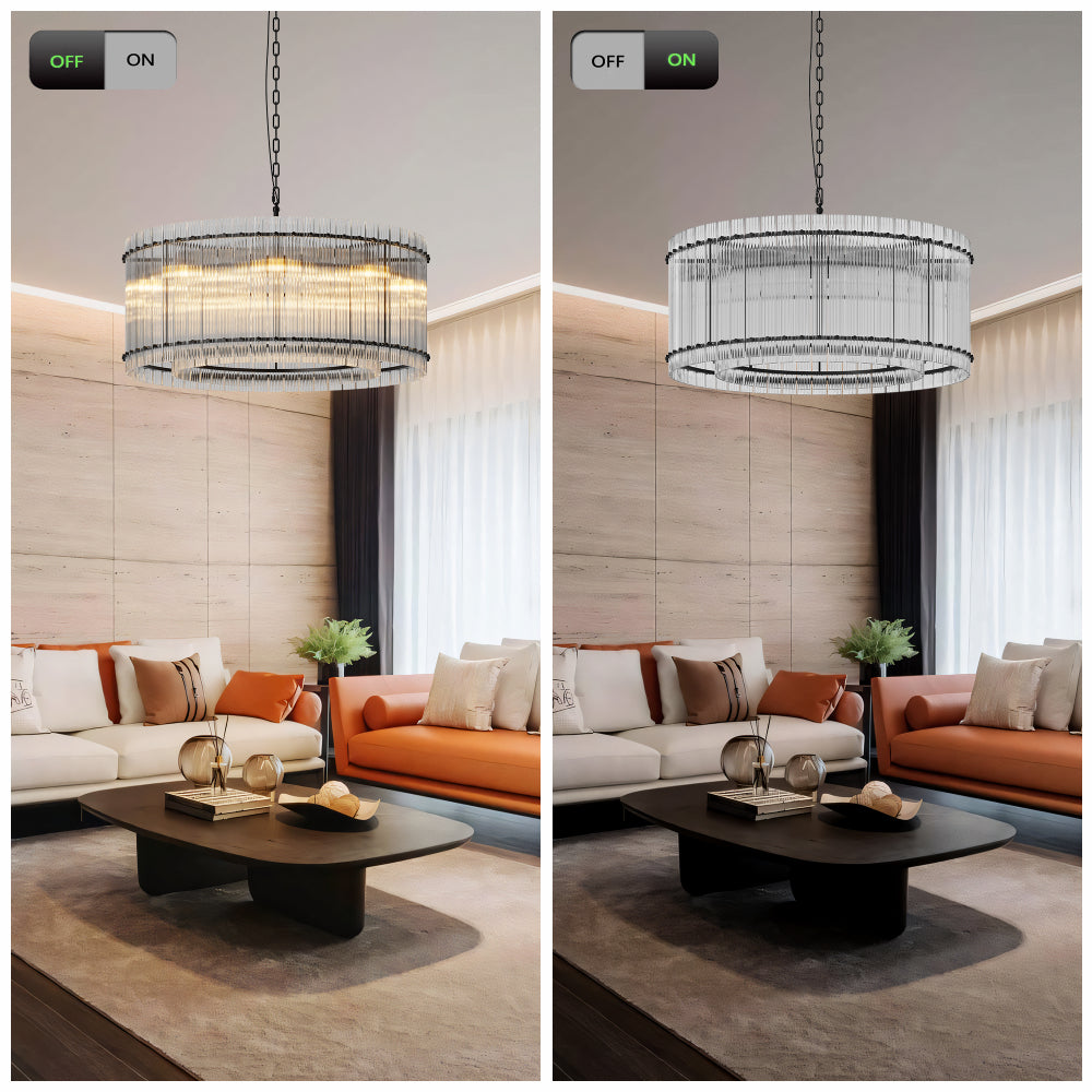 Modern round crystal glass chandelier with warm illumination on, hanging in a living room with orange and white sofas, dark coffee table, and light wood walls.