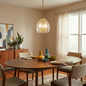 Pendant Chain Hanging Light with satin brass finish and ribbed clear glass shade, hanging over a wooden dining table with colorful bowls and vases.