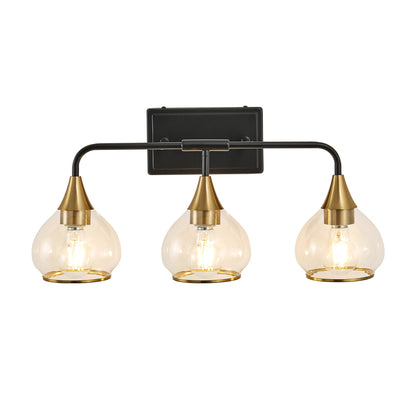 Black and gold 3-light vanity wall sconce with clear glass shades, industrial design for bathroom or living spaces.