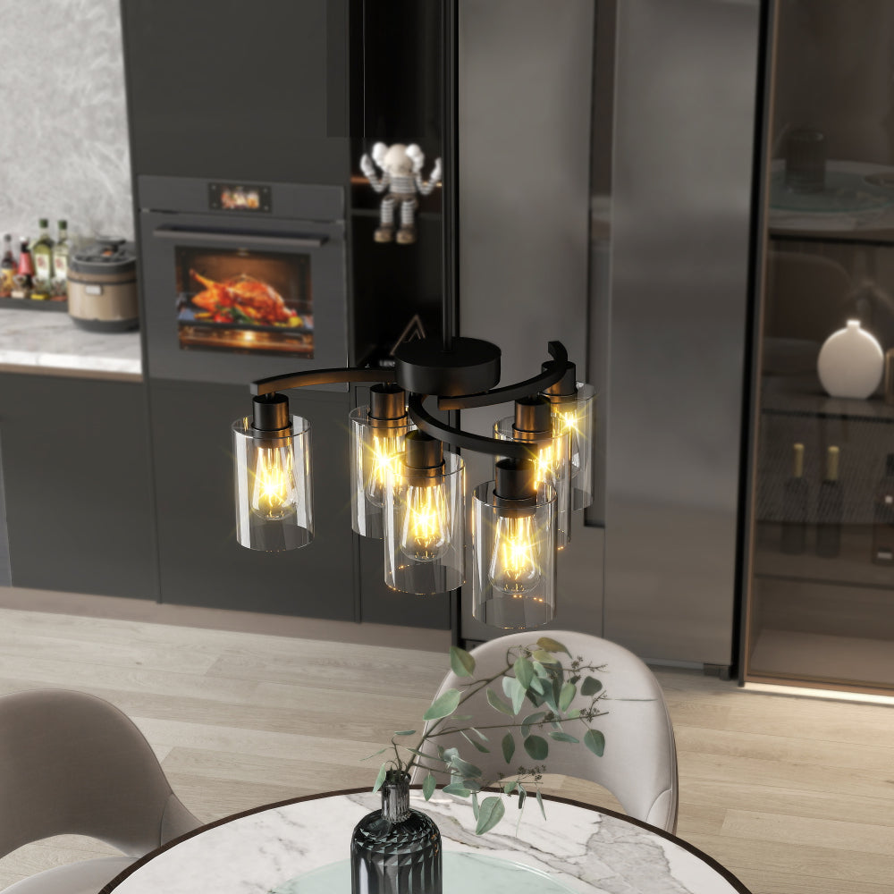 Black Modern Farmhouse 6-light chandelier with clear glass shades, warm bulbs, hanging over a marble dining table in a modern kitchen.